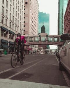 a person riding a bicycle on a street