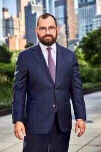 Alex Shulman in front of Shulman & Hill's Manhattan Office
