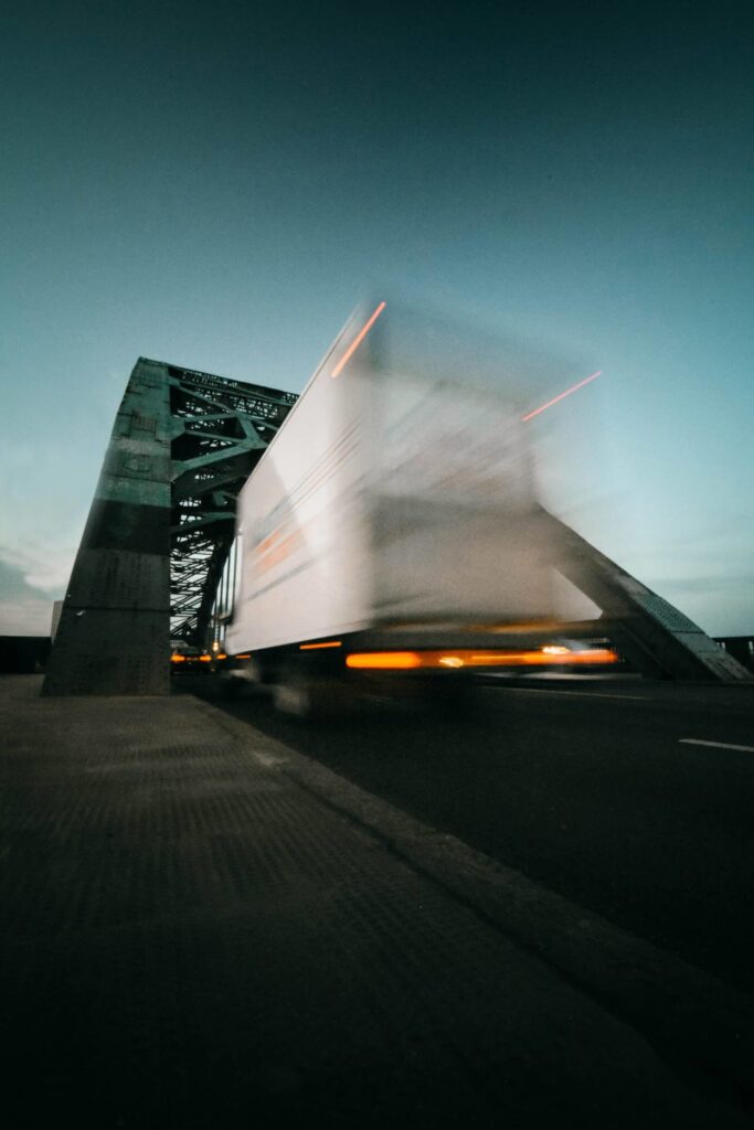 a truck driving on a bridge