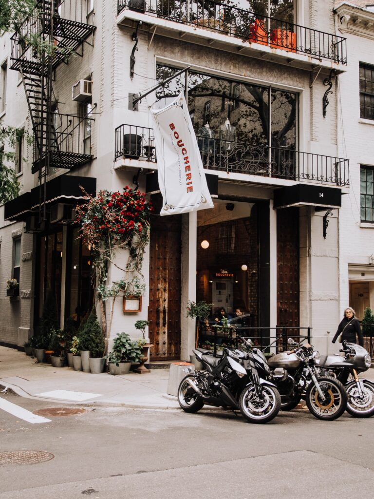 a group of motorcycles parked outside of a building
