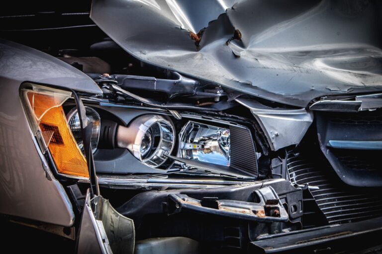 a damaged car with a damaged front end