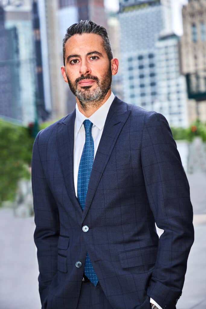 JJ Hill's headshot out of Shulman & Hill's Manhattan Office