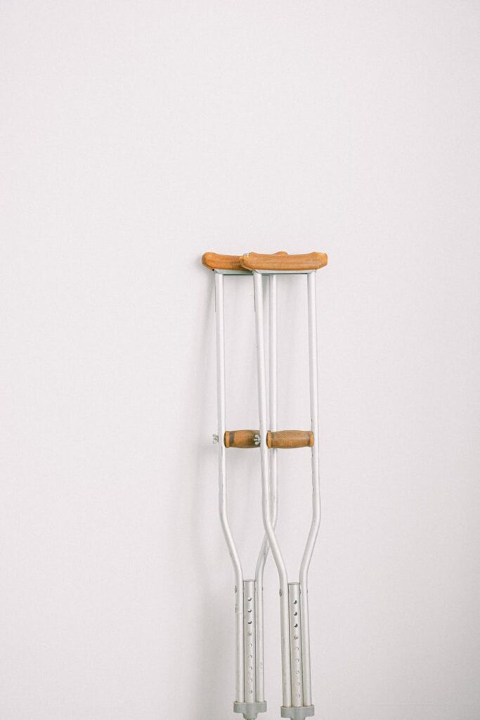 crutches on a white surface