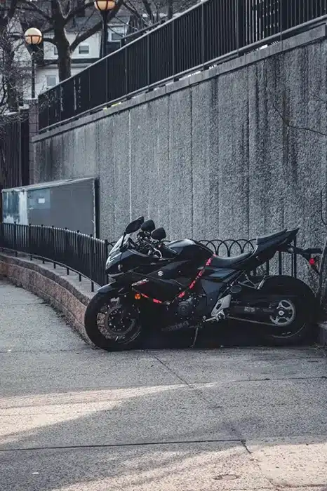 Black motorcycle parked on street in New York City