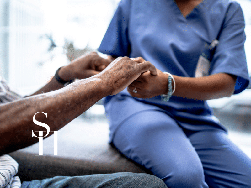 home health aide helping a patient