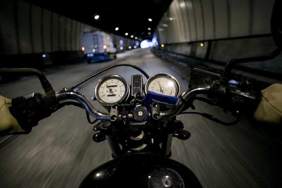 POV motorcycle driver on empty road