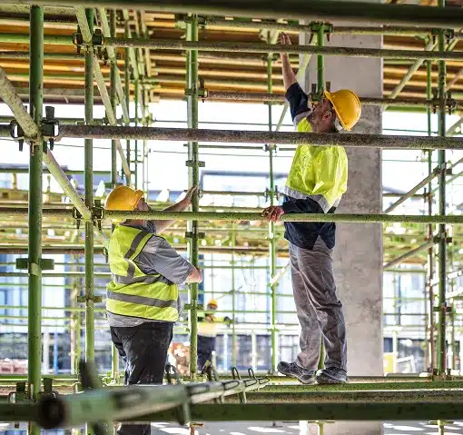 Construction workers on scaffolding