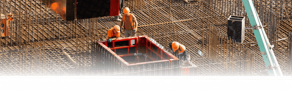 Workers working with concrete irons in a construction site