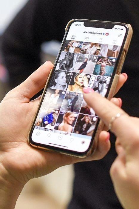 A woman viewing another person’s social media page. A lawyer can explain what can happen if your workers’ comp insurance adjuster watches your social media.