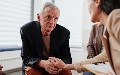 A grieving older man sits down with his lawyer to determine who can file a survival action in New York.